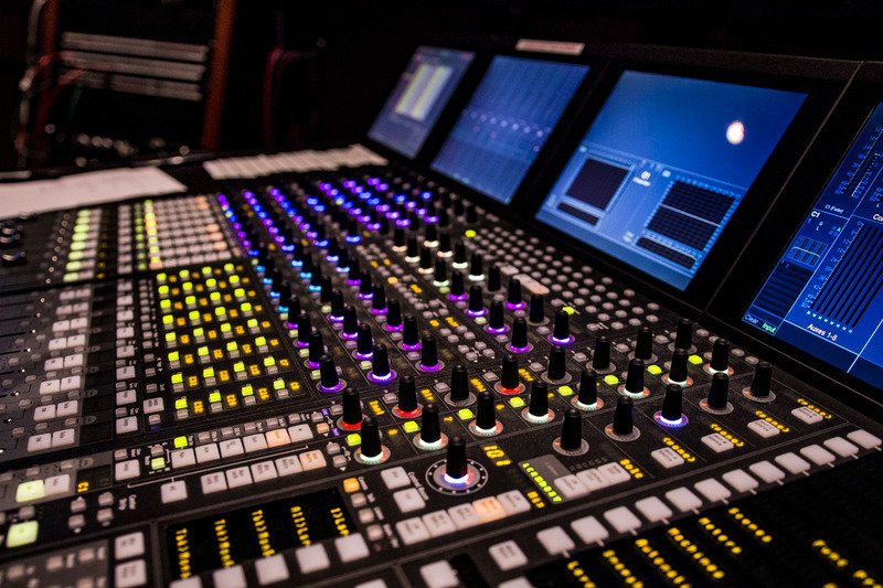 Music production soundboard. Console for music studios. Professional recording arts.